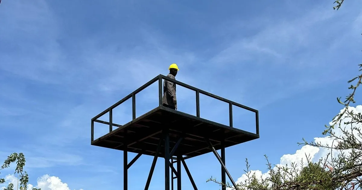 A newly built elevated water tower against a blue sky